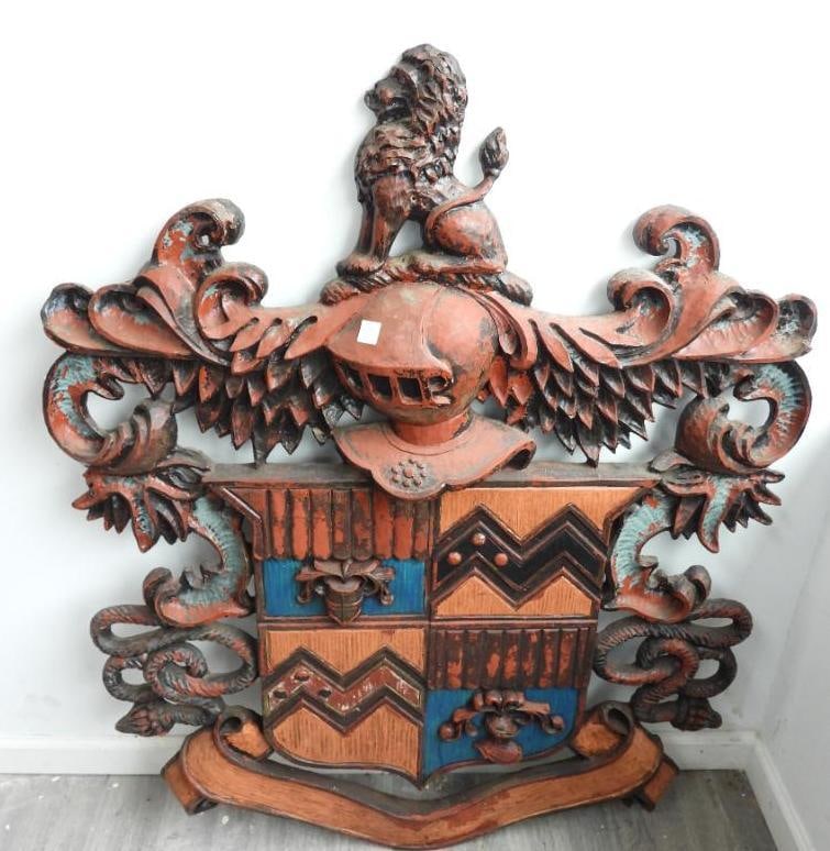 Resin material Carved wood design coat of arms, escutcheon: Resin material painted Carved wooden design coat of arms, escutcheon, used in Europe to identify individuals, families, or organizations, 36" at widest and 46" at tallest