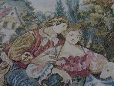 Woven tapestry wall hanging depicting a couple in a French landscape scene