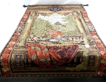 Tapestry wall hanging with a scenic design of flowers, building and figures on horseback
