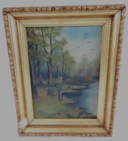 Framed old oil painting in a gold-colored ornate frame