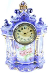 Porcelain mantle clock, made in England, with gold gilt finish and painted roses