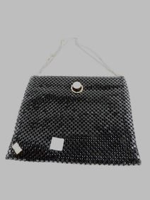 Vintage black mesh purse with a gold-tone clasp and chain strap