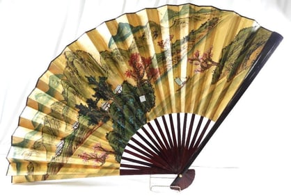 Hand-painted Chinese gold leaf folding wall fan featuring a landscape design