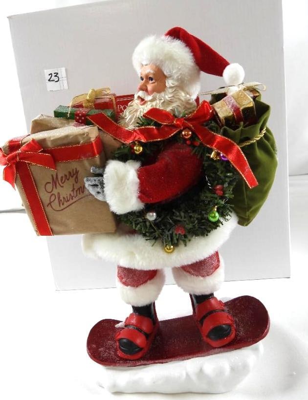 POSSIBLE DREAMS CLOTHTIQUE Tearin It Up Santa: Dept 56 POSSIBLE DREAMS Tearin It Up Santa #6005291. Santa is holding packages, with a sack on his back riding a snowboard. . New in original white box. Never displayed. 12.5"T x9" at longest part and