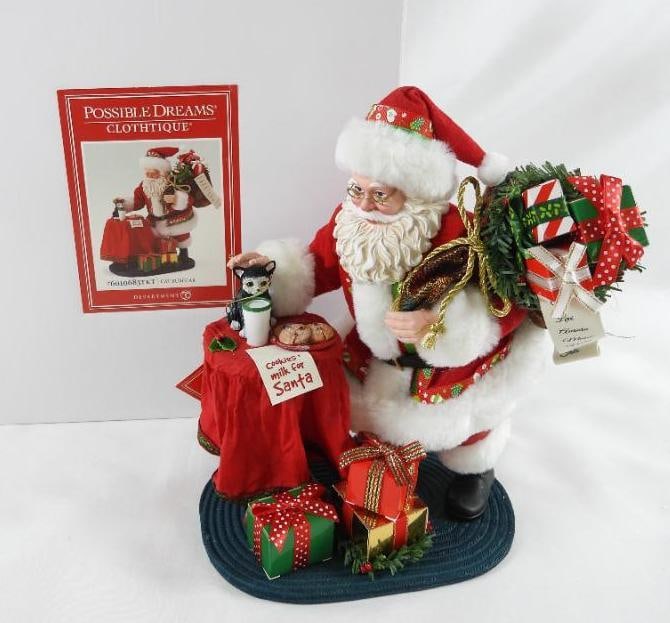 POSSIBLE DREAMS CLOTHTIQUE Cat Burglar Santa NIB: Dept 56 POSSIBLE DREAMS CLOTHTIQUE Cat Burglar Santa with presents and petting cat on table with cookies and milk and a note that reads "cookies & milk for Santa" #6010683TKT. New in original white bo