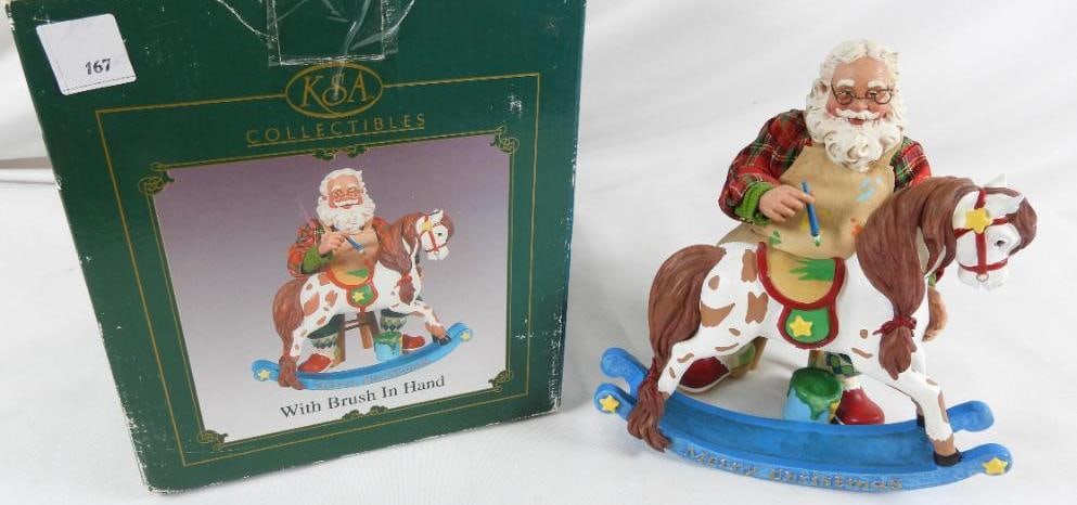 KSA COLLECTIBLES "With Brush in Hand" Santa J1813: KSA COLLECTIBLES "With Brush in Hand" J1813 in original box. Santa sitting with brush 9"Tx4"Lx4.5"W and Rocking Horse 7"Tx7.5"Lx 2"W
