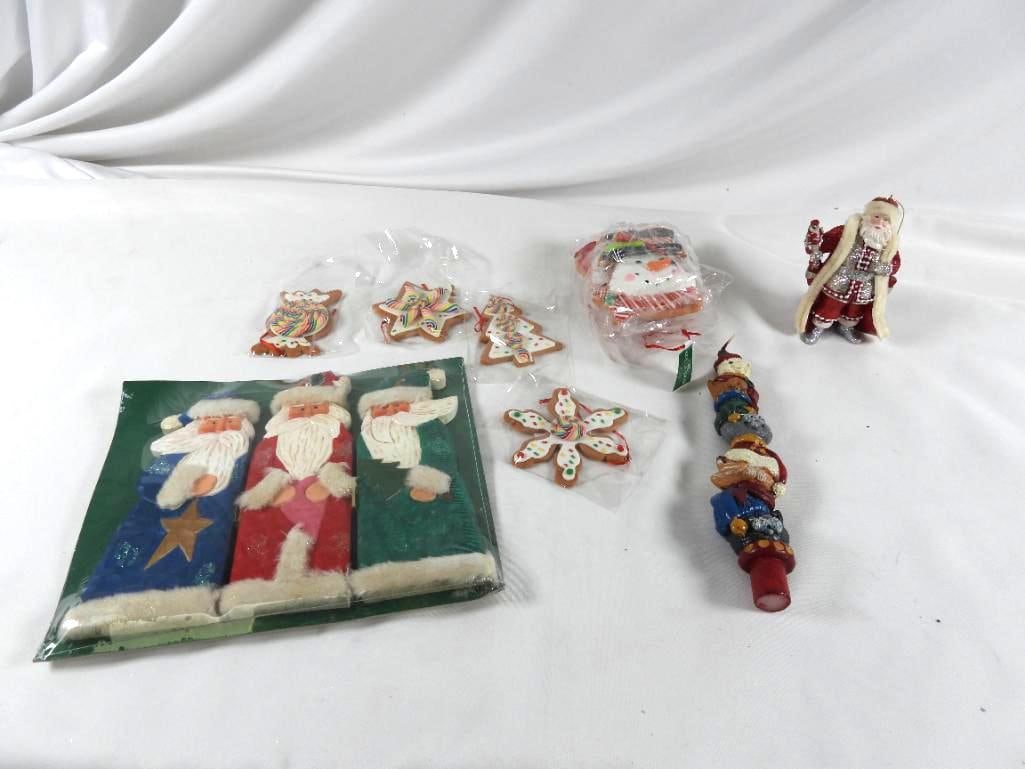 LOT OF 11 KURT S. ADLER ornaments and more: LOT OF 11 KURT S. ADLER: Santa glittery ornament 5"Tx3"Lx2"W, 8 gingerbread cookie ornaments from trees, to Santas to snowmen, all approx. 4"Tx4"W, and 9.5"T cat candle, 3 Santas NIP, each approx. 8"T