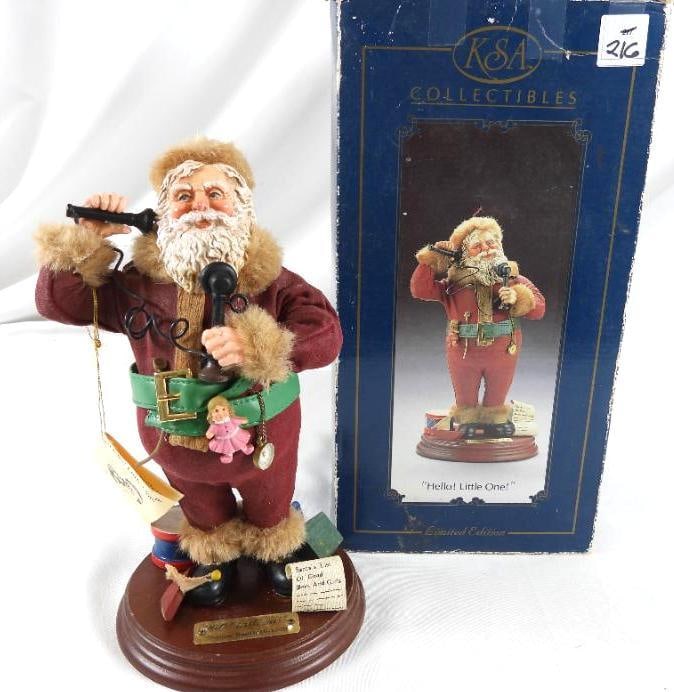 KSA COLLECTIBLES Hello! Little One! Ltd Ed. Santa: KSA COLLECTIBLES Hello! Little One! Limited Edition Santa holding vintage telephone on brown platform (Thomas Nast 1840-1902) plaque), W1552, in original box. Dimensions: 11"Tx5.5"Lx4"W