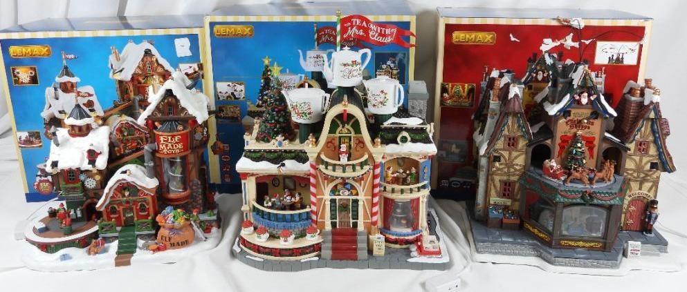 LOT OF 3 LEMAX Factories/Shops, in original boxes: LOT OF 4 LEMAX Sights and Sounds Factories/Shops, in original boxes (not tested): Christmas Shoppe #55026, 11"Lx7"Wx14"T (with attachment), Elf Made Toys, #75190, 11"Lx7"Wx10"T, and Tea With Mrs. Clau