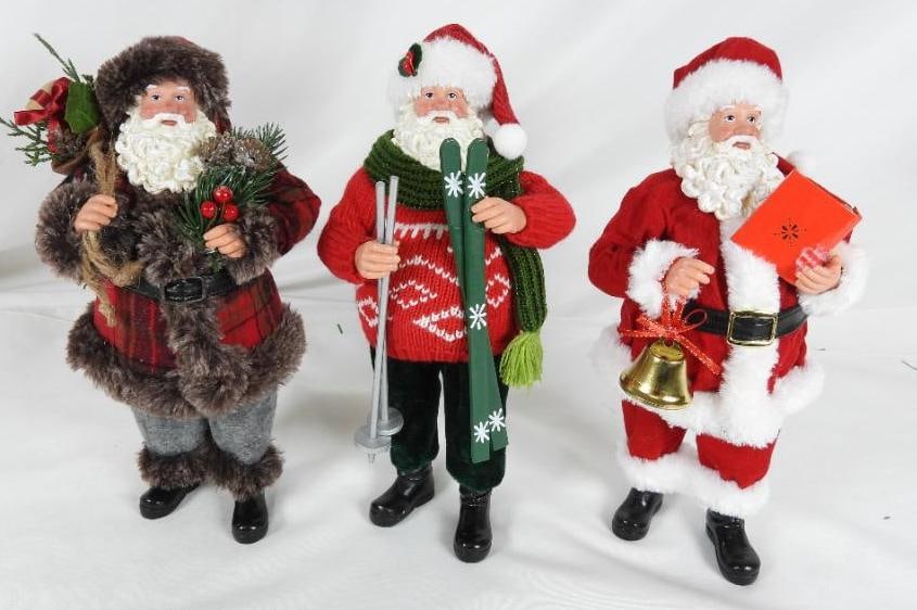 LOT of 3 SANTAS including skis, outdoorsy, bell: LOT of 3 SANTAS: Santa with green scarf and skiis, 5"Lx5"Wx11"T, Santa with outdoorsy items 5"Lx5"Wx11"T, Santa with songbook/bell 5"Lx4"Wx11"T