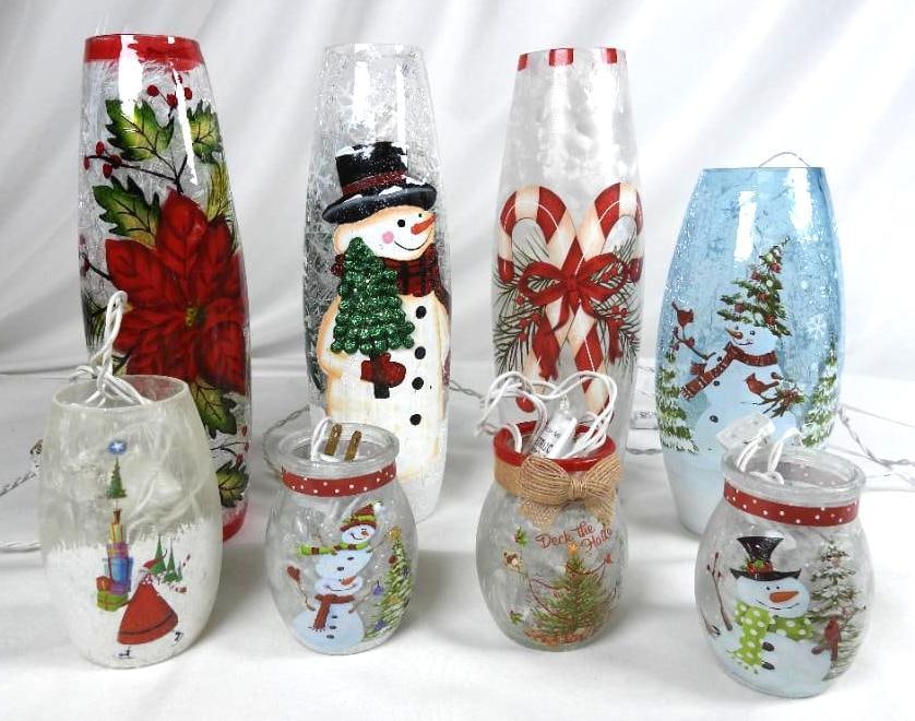LOT OF 8 ILLUMINATED frosted holiday decor: LOT OF 8 ILLUMINATED frosted holiday d?cor: 3 frosted 3"Lx3"Wx4.25"T with snowman, deck the halls and snowmen decorating tree, Santa holding presents 3"Lx3"Wx5.25"T, Blue luminary with snowman/cardina
