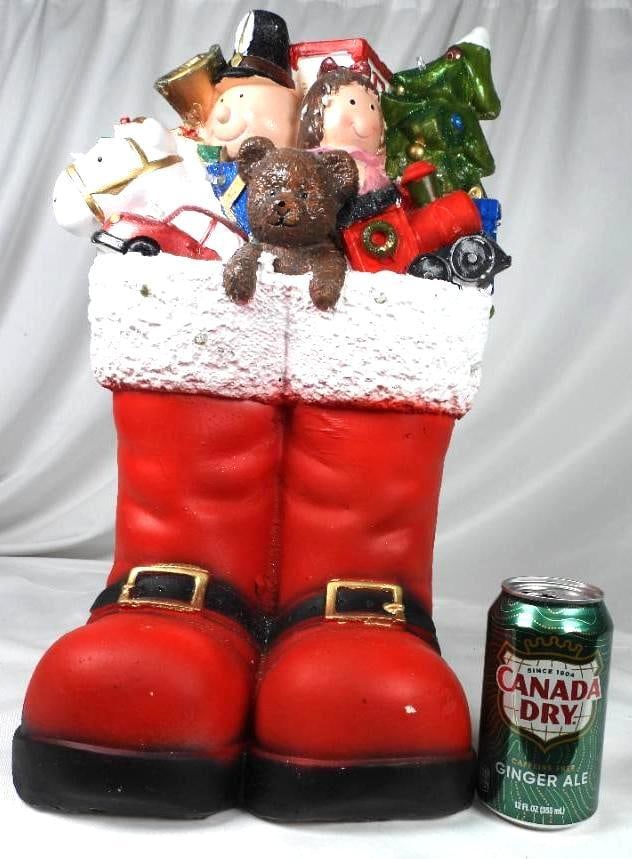 Large Santa Red Boots full of toys decor: Large Santa Red Boots full of toys d?cor, 9"Lx8.5"Wx18"T, (takes two AA batteries, not included and not tested), one minor crack in red boot