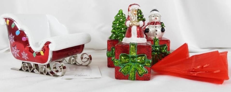 LOT OF 4 including VALERIE PARRHILL Sleigh, etc.: LOT OF 4 including VALERIE PARRHILL Sleigh candleholder, 6.5"Lx5"Wx5"T, 3 presents with tree, snowman, Santa on top, 2.5Lx3"Wx6"T each with red gift bags, not tested.