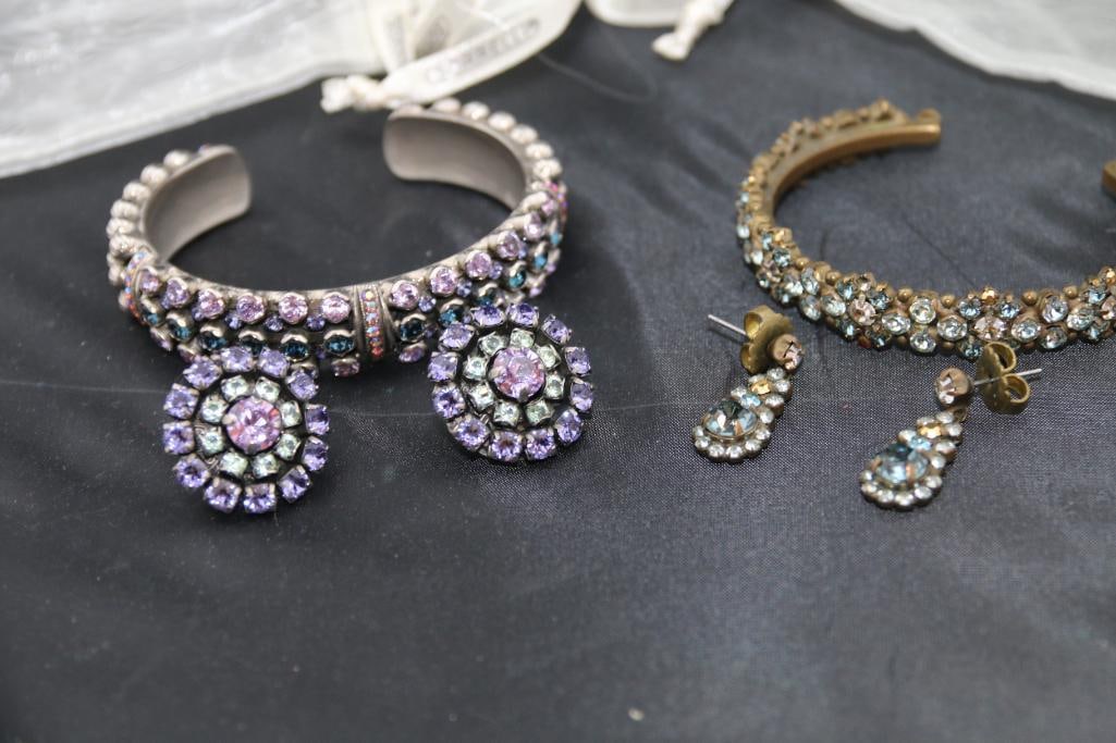 Sorelli Designer Jewelry Lot of 2 bracelet & earring sets: Includes 2 cuff bracelets with coordinating earrings. 1 Silver tone earrings and cuff in pink blue and lavender crystal rhinestones. Cuff is 3 rows and 2.25" across. Earrings are 3 circle multi color