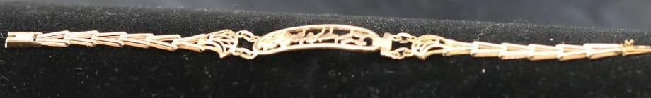 Gold 7" link bracelet from Greece Test 10Kt. 9 grams: Gold tone Egyptian design link bracelet. Only hallmark is VI. Electronically tests for 10Kt. 12