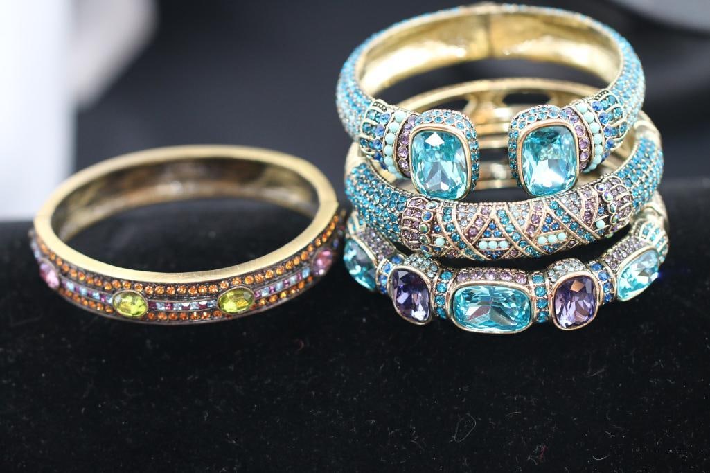 Lot of 4 Heidi Daus Designer multi color cuff bracelets: Gorgeous brushed and bright brass tone wide cuff bracelets with huge faceted blue topaz and amethyst color stones with faux turquoise in 3 cuffs and multi color crystals in one. Absolutely stunning fa