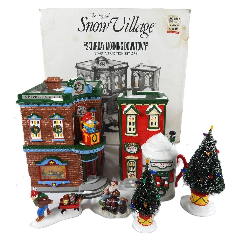 DEPARTMENT 56 Original SNOW VILLAGE, original box: DEPARTMENT 56 Original Snow Village in original box, bulb included not tested, "Saturday Morning Downtown". Item #54902: Krangles Toy shop: 6"Lx6"Wx"8.5"T; Nikki's Cocoa shop: 5"Lx5.5"Wx7"T; tall tree