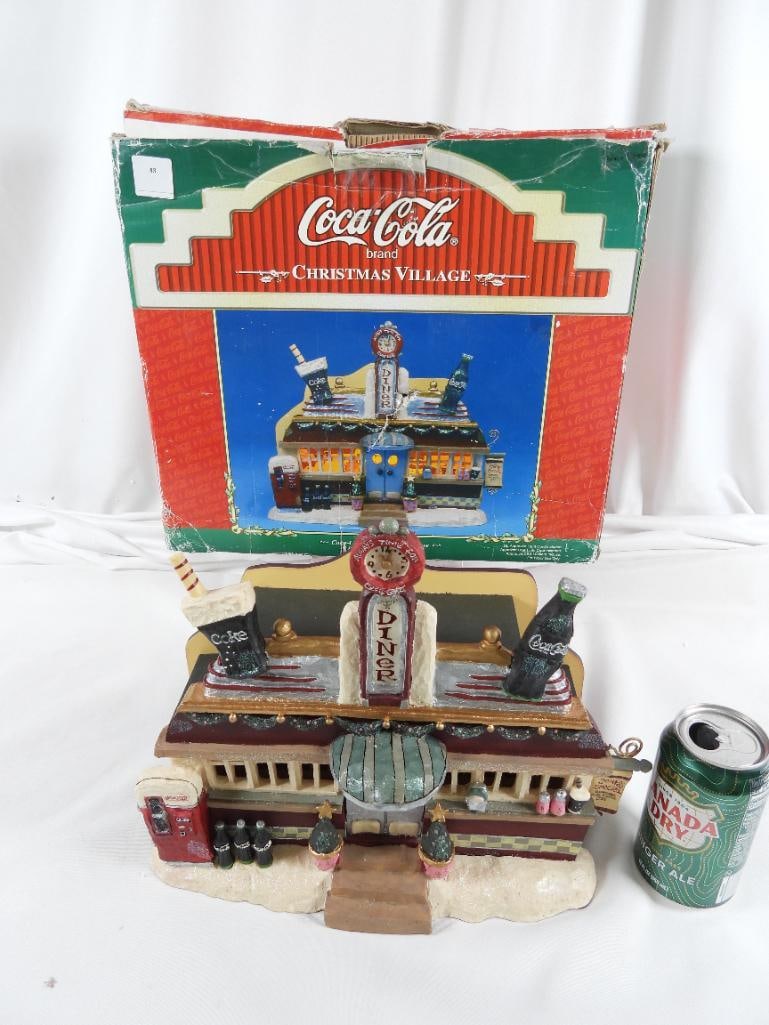 COCA-COLA CHRISTMAS VILLAGE LIGHTED Diner in box: COCA-COLA CHRISTMAS VILLAGE LIGHTED Diner in original box, corded bulb included, not tested, 12.5"Lx5.5"Wx11"T