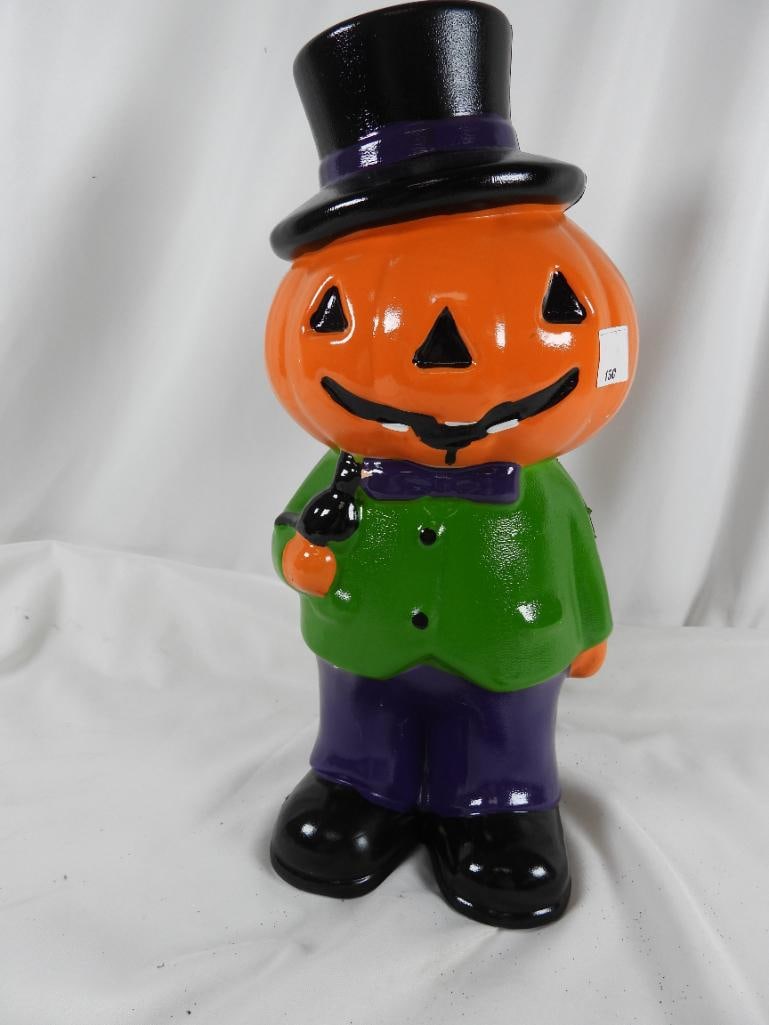 Mr. Halloween Large Plastic Pumpkin Man Yard décor: Mr. Halloween Large Plastic Pumpkin man in suit and bowtie w/top hat illuminates from the inside and takes 3C batteries that are covered by a circular plastic cover and also comes with two metal spike