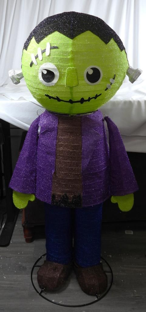 MEMBER'S MARK Outdoor Frankenstein: MEMBER'S MARK Large outdoor plastic fabric with metal frame illuminates from the inside by string lights detaches in 4 sections including the arms NOT TESTED L24"xW18"xH60"