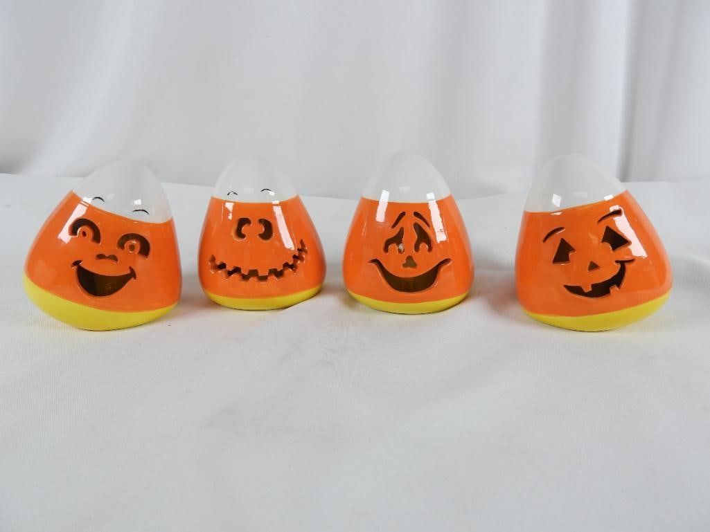 MR CHRISTMAS SET OF 4 CERAMIC CANDY CORN: MR CHRISTMAS Set of 4 Candy Corn illuminated décor with various faces 2 have slight cracks in the glazing each takes 2 AA batteries not included NOT TESTED L4"xW3"xH4.5"