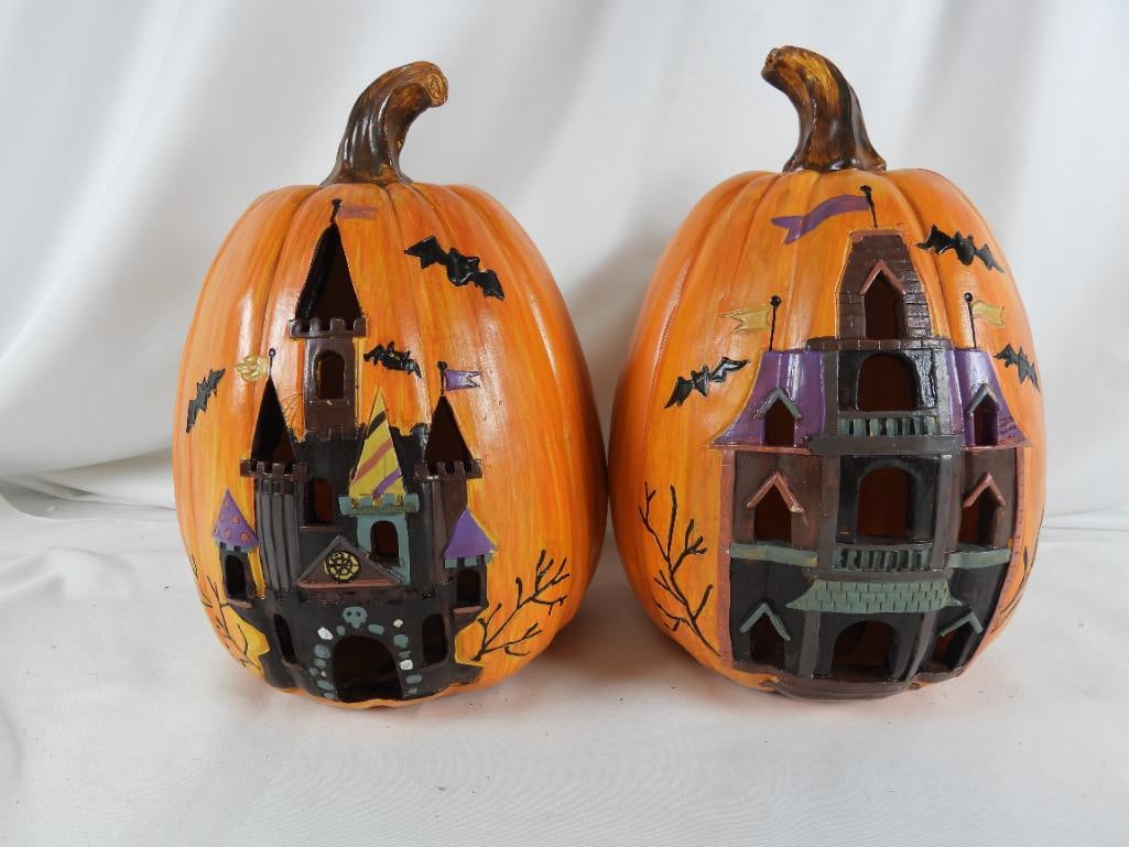 LOT OF 2 TL Collection HALLOWEEN Jack-o-Lanterns: LOT OF 2 TL Collection LED Resin HALLOWEEN Jack-o-Lanterns J5112, both with haunted house castle, bats, and flags, etc., 7.5"Lx7"Wx12"T.