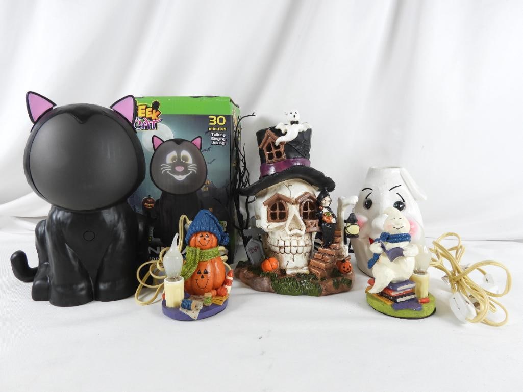 LOT OF 5 HALLOWEEN lighted and animated decor: LOT OF 5 HALLOWEEN: white spooky face plug-in lamp, 4"Lx4.5"Wx6.5"T; jack-o-lanterns with crafts and plug-in-light bulb, 3"Lx3"Wx4.25"T; Ghost reading on stack of books with plug-in bulb, 3"Lx3"Wx4.75