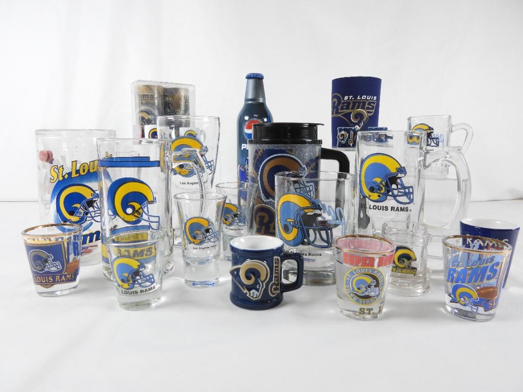 LOT OF 23 NFL ST LOUIS RAMS glassware, PEPSI, etc.: LOT OF 23 NFL ST LOUIS RAMS: Steven Jackson PEPSI Believe in Now 16-ounce filled bottle; plastic handled mug with lid; tall TEAM NFL RAMS 6.5"T glass; two handled heavy glasses; plastic handled mug