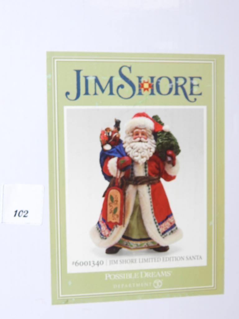 JIM SHORE POSSIBLE DREAMS Limited Edition Santa: Dept 56 JIM SHORE POSSIBLE DREAMS Limited Edition Santa holding tree, sled and bag of toys, #6001340 in original box. Dimensions: 14"Tx8"Lx7"W