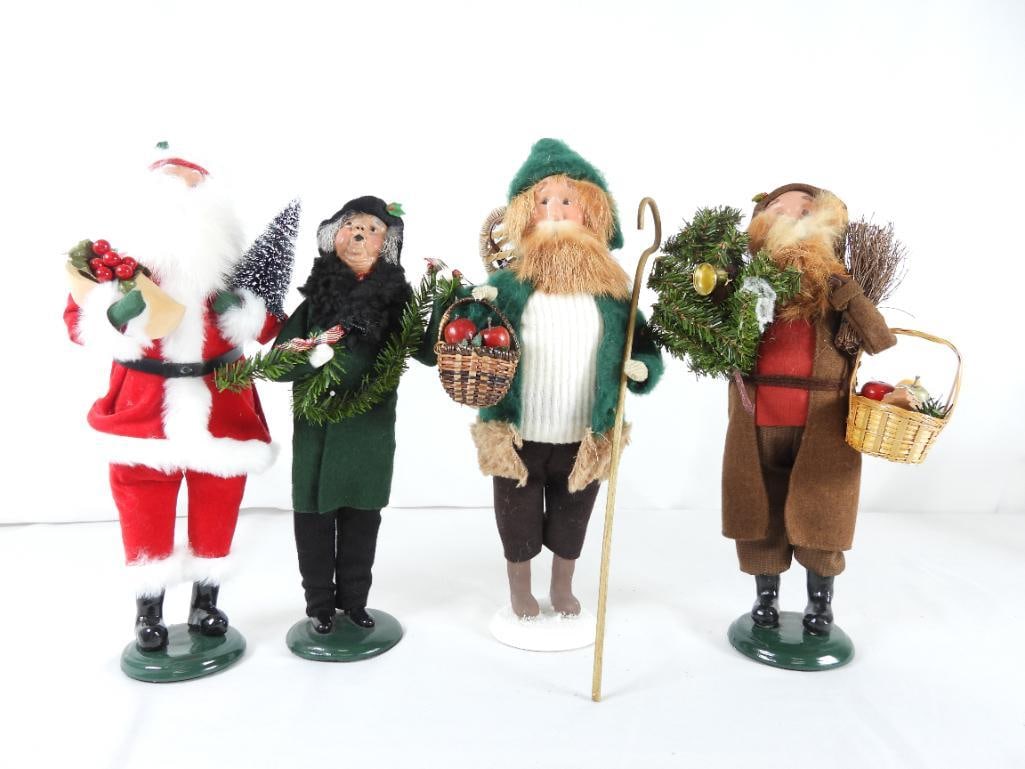 LOT OF 4 BYERS CHOICE CAROLERS, JOYCE BYERS SIGNED: LOT OF 4 BYERS CHOICE CAROLERS: Man caroler with hook staff and basket of apples, JOYCE BYERS SIGNED, 7"Lx6.5"Wx14.5"T; Woman caroler with garland with plaid bows, BYERS 95 79/100 SIGNED, Limited Edit