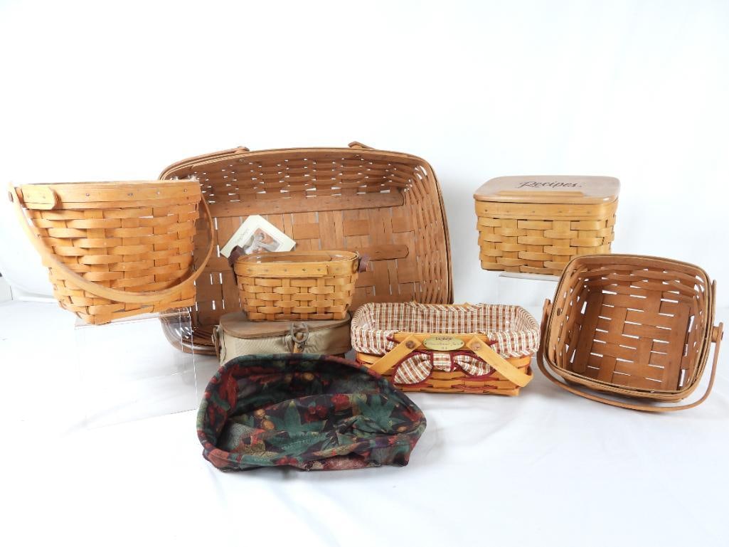 LOT OF 8 LONGABERGER BASKETS/ACCESSORY: LOT OF 8 LONGABERGER BASKET + ONE LINING: (All baskets have plastic lining except 2 and item number is taken from plastic lining) One basket with movable handle a beige lining and lid that closes with