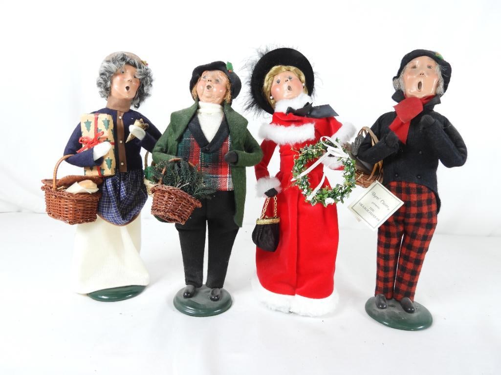 LOT OF 4 BYERS CHOICE CAROLERS BYERS SIGNED XMAS: LOT OF 4 BYERS CHOICE CAROLERS 2 BYERS SIGNED XMAS THEME: Man caroler dressed in grass and red plaid holding basket of greens 1996 L5"xW5"xH13"; "The Village Peddler" Caroler made for "Truffles LTD."