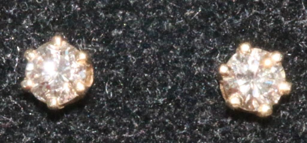 Pair of 14kt gold diamond earrings. (1 of 4)