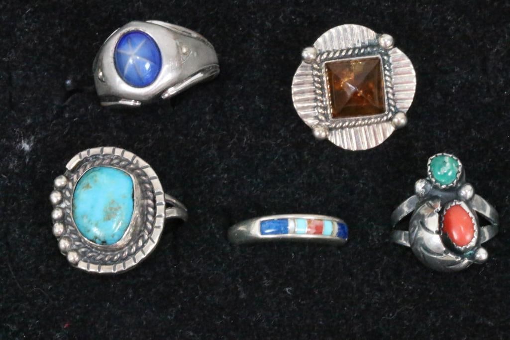 Lot of 5 rings 4 sterling & 14kt HGE: 14kt HGE Blue star sapphire. 4 sterling silver native turquoise, coral, amber carnelian lapis . Sterling rings weigh 24.3 grams