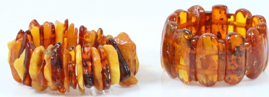 Huge lot of 2 Vintage chunky Baltic amber chunky bracelets: Lot includes 2 stretch bracelets. One is alternating large and medium ovoid amber stones on a double stretch band largest amber bead I 1" Fits up to 8" wrist. Bracelet with multi color amber is gorgeo
