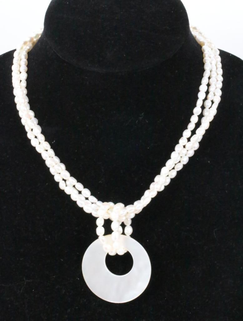 NEW Honora Freshwater Pearls 3 strand pendant necklace: NEW with the HONORA HANG TAG & HONORA POUCH Gorgeous 3 strands of 7mm pearls with a large round open disc pendant 1-3/4" diameter 18" long. Sterling silver hallmarked clasp.