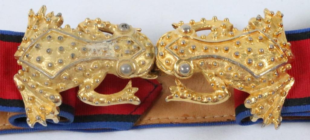 Vintage Mimi Di Nascemi 1975 Frog belt and 2 buckles: Hallmarked gold plate Mimi Di N Frog hook and clasp Belt buckles with fabric red and blue belt leather lined. 31" long x 1.25" wide adjustable belt strap. Some light gold loss on parts of the frogs.