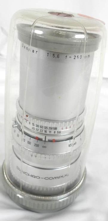 VINTAGE 68" ALUMINUM TAPER TREE TINSEL W/ BOX & LIGHT: This is an amazing RARE find with a tall 5'8" to the top of the tree (top branch) with graduated size branches up to 24" long. The original light silver gray painted poles come together in the origina