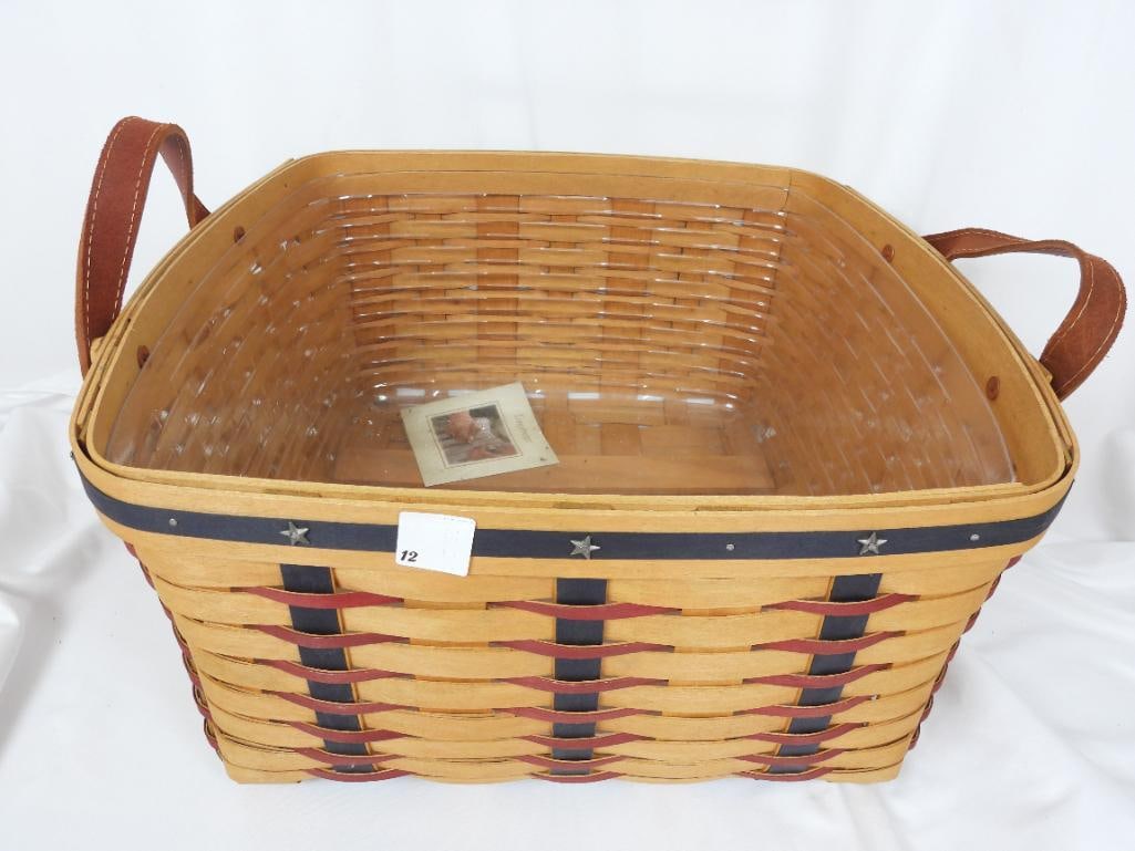 Large LONGABERGER BASKET with leather handles patriotic: LONGABERGER BASKET: 1 Longaberger basket with two leather handles and stars + stripes along the basket exterior L17"xW15"xH8.5"