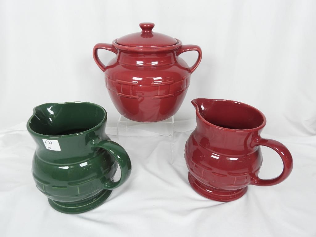 LOT OF 3 LONGABERGER POTTERY 2 pitchers and bean pot: LOT OF 3 LONGABERGER POTTERY PITCHERS + Bean Pot : 3 Longaberger pitchers with decorative woven pattern in red and green L9"xW6"xH8" with an additional urn + matching lid L10"xW8"xH7.5"