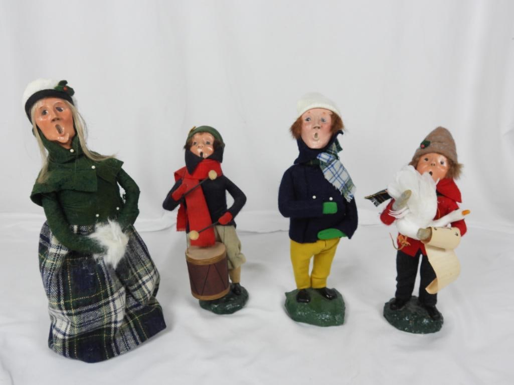 LOT OF 4 BYERS CHOICE CAROLERS 1980's: LOT OF 4 COLLECTABLE BYERS CHOICE ORIGINAL CAROLERS:1 Drummer caroler 1982 L4"xW3"xH10"; 1 Caroler holding a white goose and a music sheet 1983 L4"xW4"xH10"; 1 Caroler dressed in navy blue and