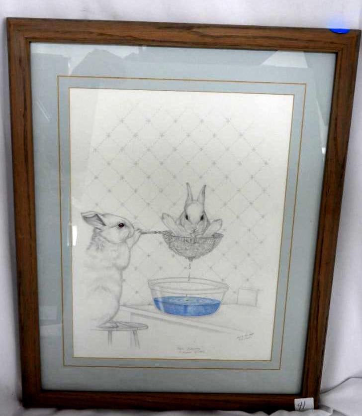 LIMITED EDITION SIGNED SUE RUPP WATERCOLOR "HARE COLORING" FRAMED: LIMITED EDITION SUE RUPP PRINT: 1 Print of a Sue Rupp artwork named "Hare Coloring" depicting a hare being dipped in blue coloring 318/650 1985 (dimensions without frame) 10"xW13.5" (dimensions with f