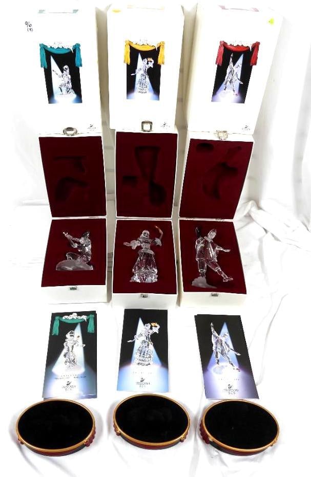 Set of 3 Swarovski Crystal Masquerade Figurines in Orig boxes: Set of 3 includes 1999 PIERROT, 2000 COLUMBINE and 2001 HARLEQUIN. All are in original boxes, in perfect condition and include the "stage" display stands.