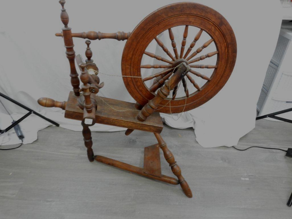 Antique Rustic Circa early 20th Century Spinning wheel with wool yarn: Fabulous spinning wheel in great antique condition. See pictures . Measures: 35" long x 34" h x 24" w. Wheel is 20" diameter.
