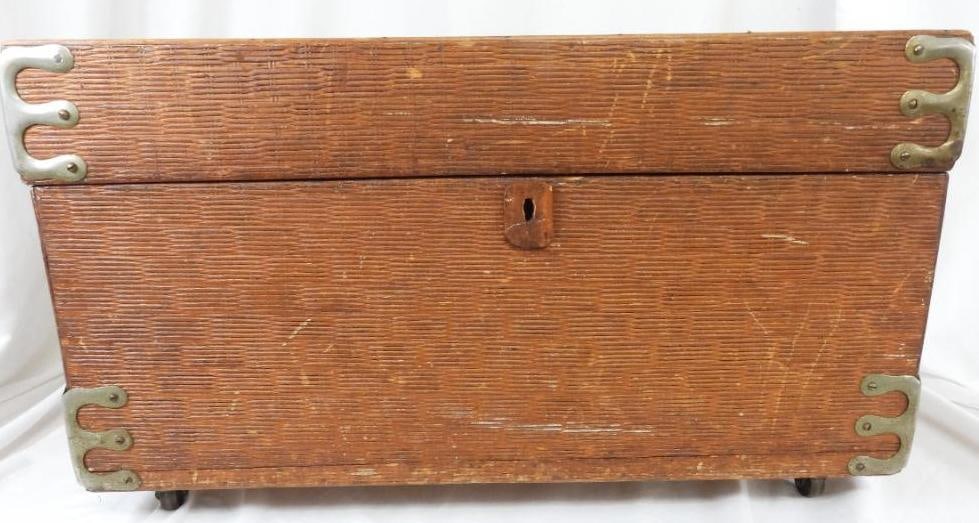Vintage Antique Wood rattan panel over wood cedar lined trunk: Demure trunk with 1/8" thick rattan boards paneled over solid 3/4" wood with cedar lining. Chain hinge Metal corners. , Wood feet. Measures: 26.5"wide x 13" deep x 15" high. Side handles.