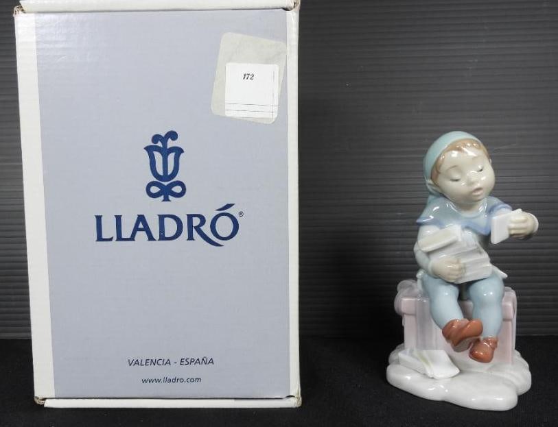 LLADRO "Delivering Magic" Elf Santa's Magical Workshop Porcelain Figurine In original box: Santa's Magical Workshop Series. Elf with a blue outfit sitting on a pink package holiday stack of letters to Santa. Made in Spain. Comes in original box. No damage. EXCELLENT CONDITION . Measures: 6"
