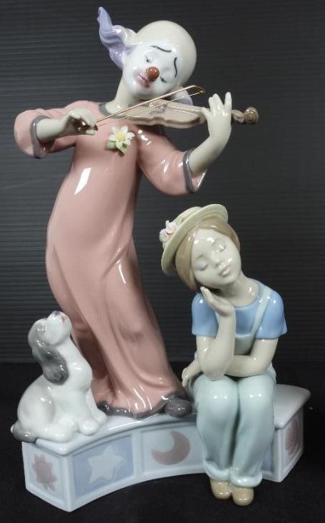 LLADRO "MUSIC FOR A DREAM" Clown Girl Porcelain Figurine In original box: Made in Spain. Comes in original box. No damage excellent condition. .Designed by Marco Antonio Nogueon . Measures approx. 11" high. This is a large figurine. Depicts a clown playing the violin for a 