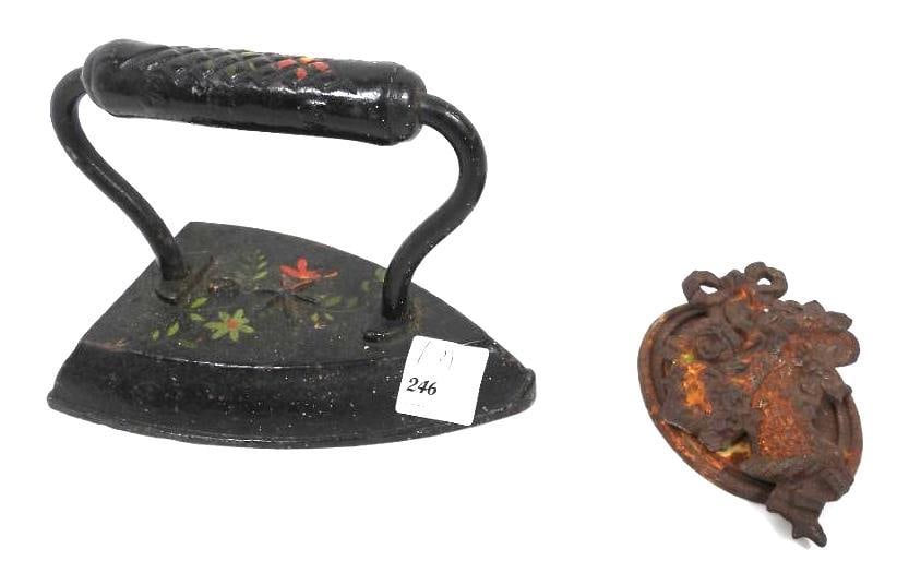 Lot of 2 Antique cast iron items : hand painted flat iron & door knocker floral design: Embossed #6 hand painted floral flat iron 6" x 4" x 4.5" h. . Victorian design flower basket and ribbon cast iron door knocker. Has corrosion rust. Can be cleaned. Measures: 4" x 2.75". Oval back