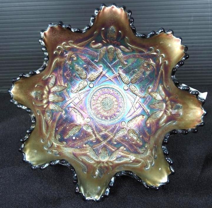 Vintage Northwood amethyst Carnival Glass bowl in the "Wishbone and Orchid" pattern: footed dish bowl. No chips cracks or damage. Measures: 7.5" x 3.25" h. Amethyst iridescent finish and ruffled edge. N stamp.