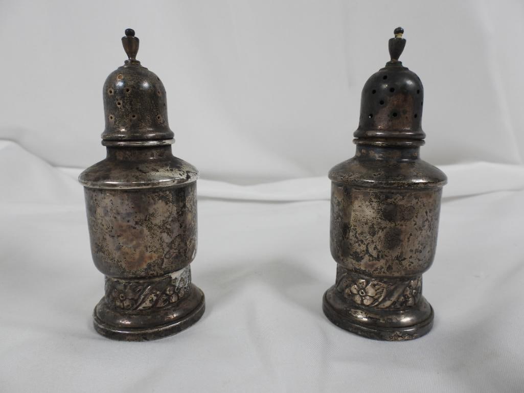 Vintage sterling silver salt & pepper shakers: 2 Vintage salt and pepper shakers made by Frank M. Whiting with floral designs at its base